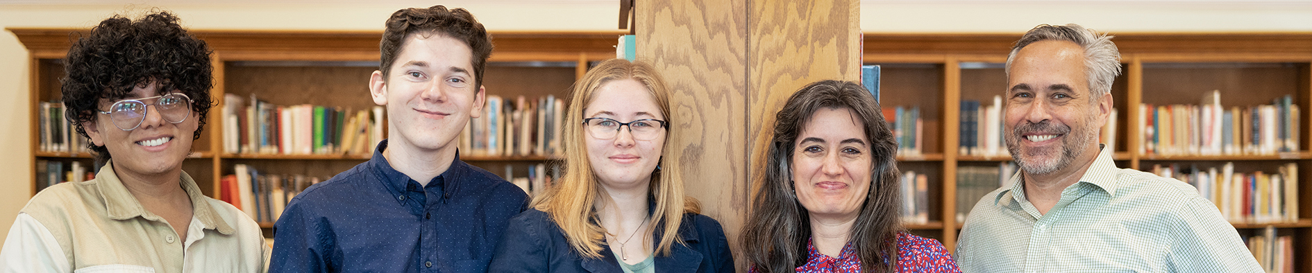 Row of people in an old library